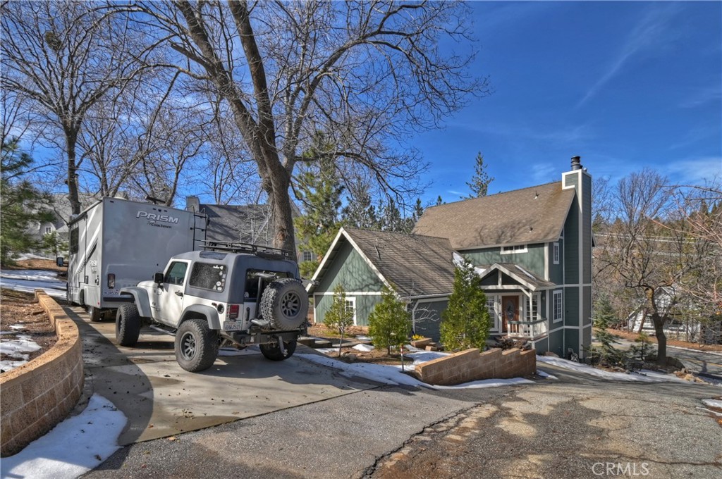 28223 North Bay Road Lake Arrowhead, CA 92352 - Photo 2 of 39 a view of house with yard and outdoor seating