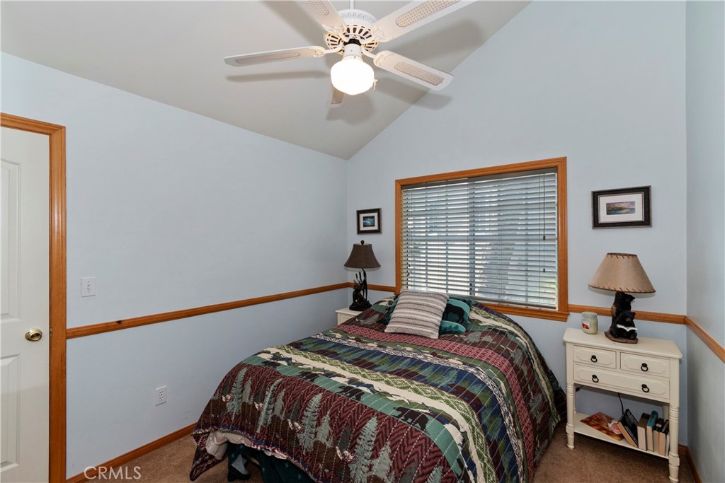 28223 North Bay Road Lake Arrowhead, CA 92352 - Photo 21 of 39 a bedroom with a bed and a window