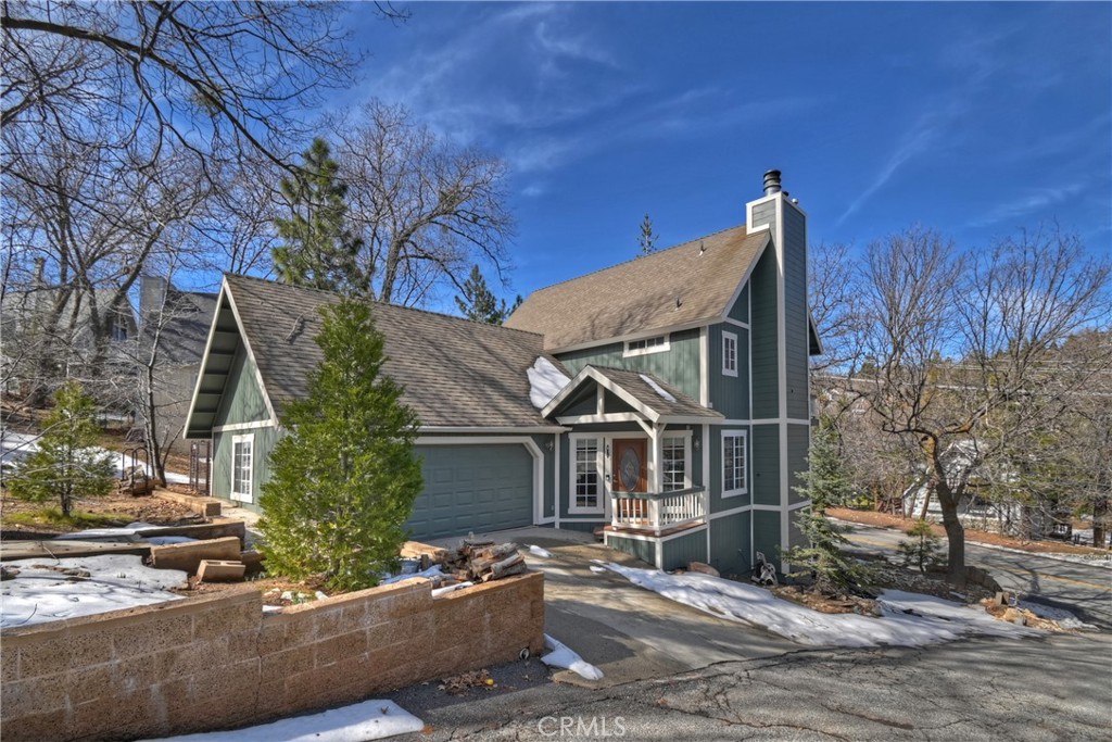 28223 North Bay Road Lake Arrowhead, CA 92352 - Photo 36 of 39 a backyard of a house with large trees and outdoor seating