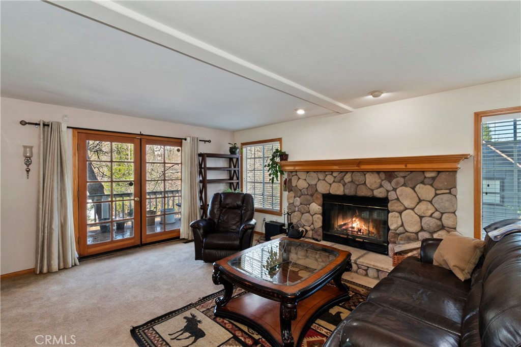 28223 North Bay Road Lake Arrowhead, CA 92352 - Photo 4 of 39 a living room with furniture and a fireplace