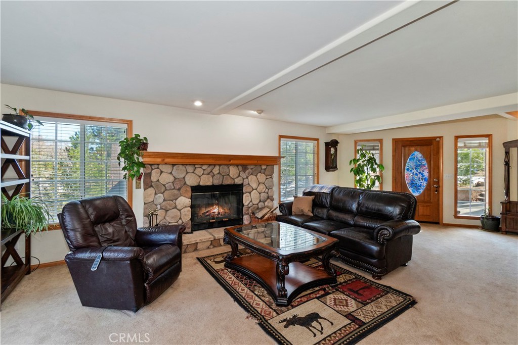 28223 North Bay Road Lake Arrowhead, CA 92352 - Photo 7 of 39 a living room with furniture and a fireplace