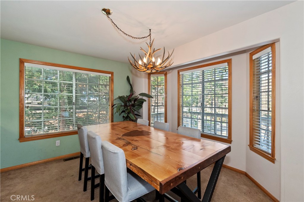 28223 North Bay Road Lake Arrowhead, CA 92352 - Photo 8 of 39 a view of a dining room with furniture window and outside view