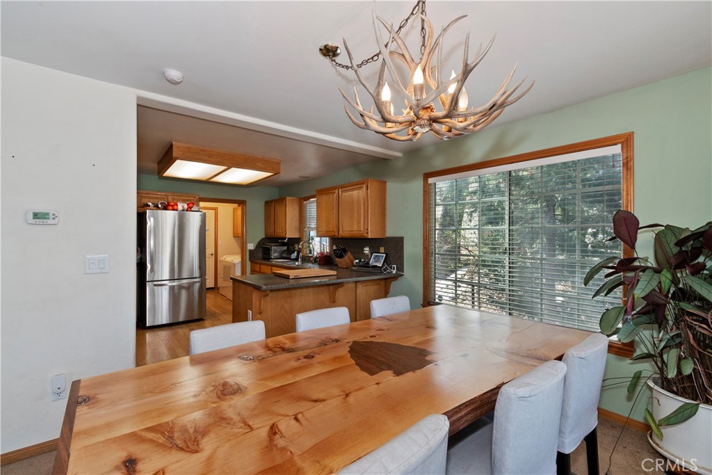 28223 North Bay Road Lake Arrowhead, CA 92352 - Photo 9 of 39 a kitchen with a table and chairs in it