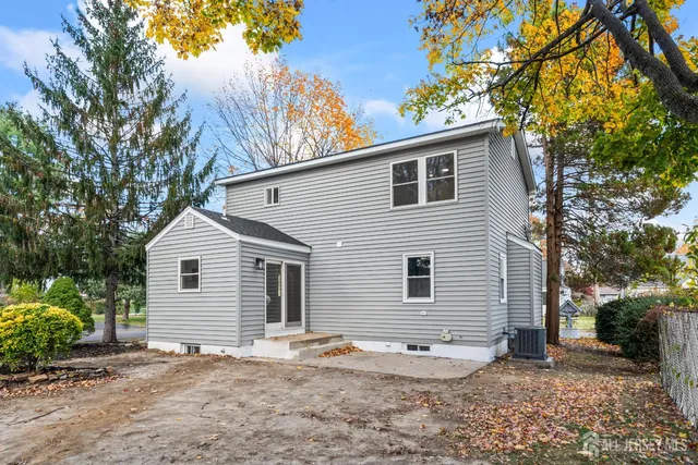 an aerial view of a house with a yard and garden