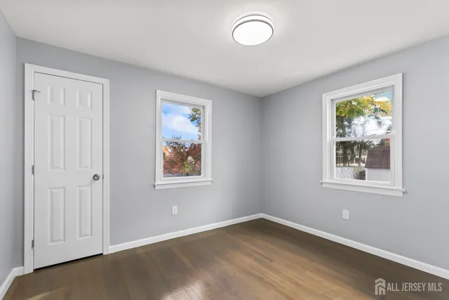 a white bath tub sitting next to a white sink and vanity