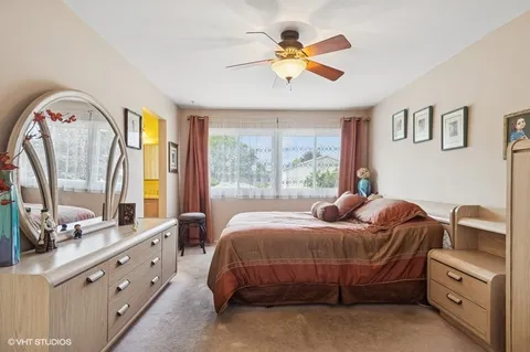 a bedroom with a bed dresser and a window