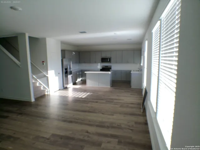 a view of a living room with a large window