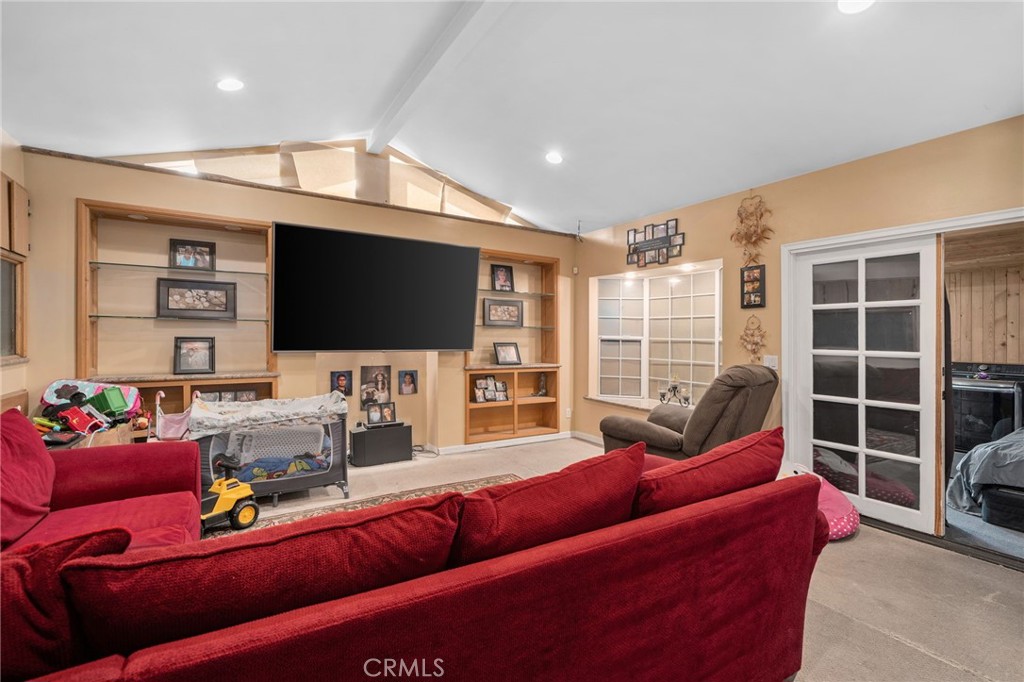 6757 Clifford Street Riverside, CA 92504 - Photo 11 of 25 a living room with furniture and a flat screen tv