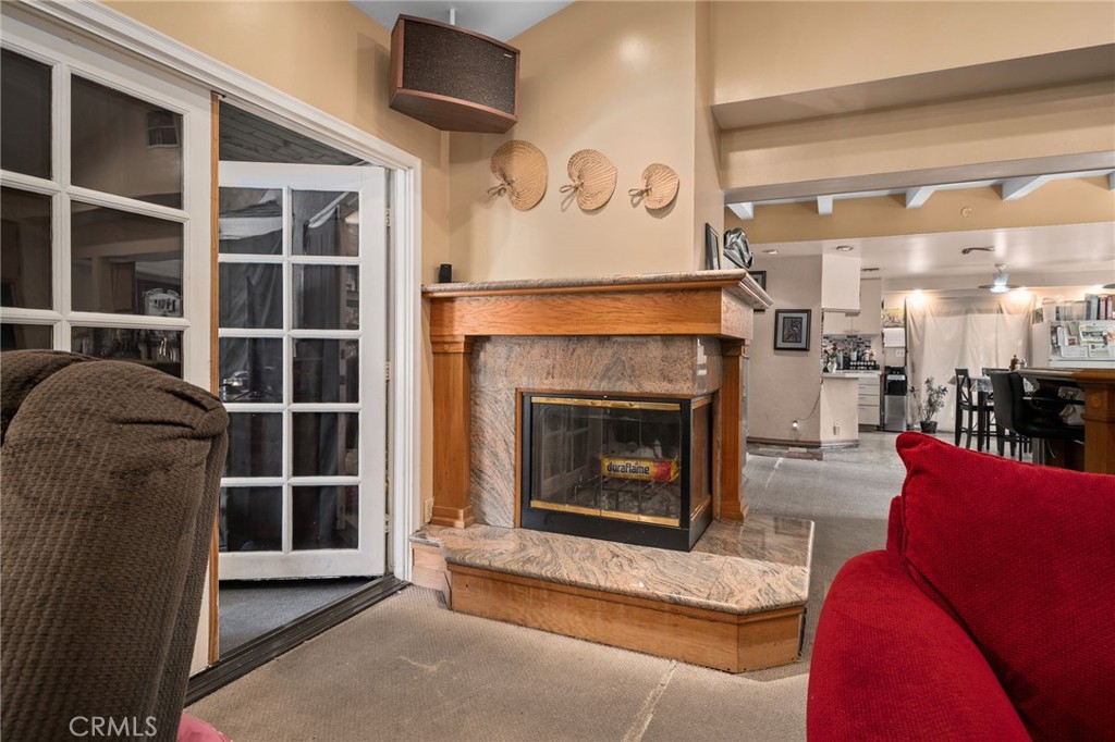 6757 Clifford Street Riverside, CA 92504 - Photo 12 of 25 a living room with furniture and a fireplace