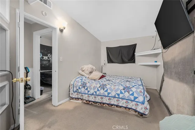 a bedroom with a bed and walk in closet