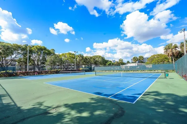 a view of an outdoor space and tennis court