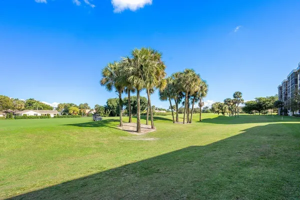 a view of a golf course with a lake view