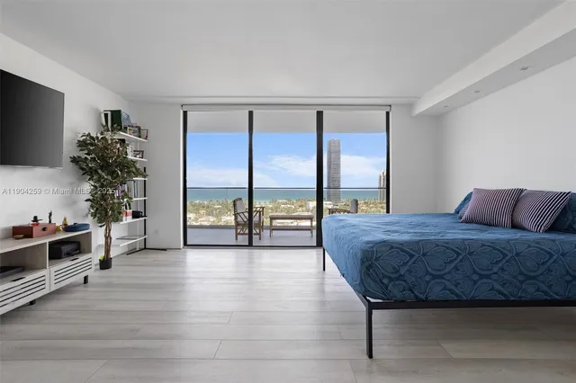 a spacious bathroom with a bathtub and a sink