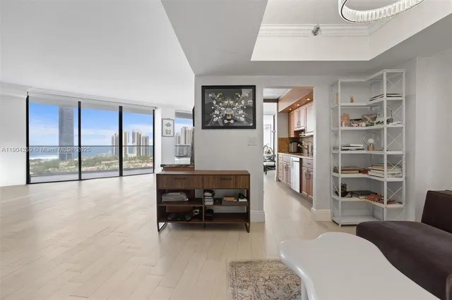 a living room with furniture and large window