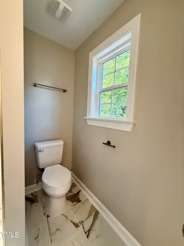 a bathroom with a toilet