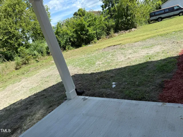 a view of a road with an ocean view