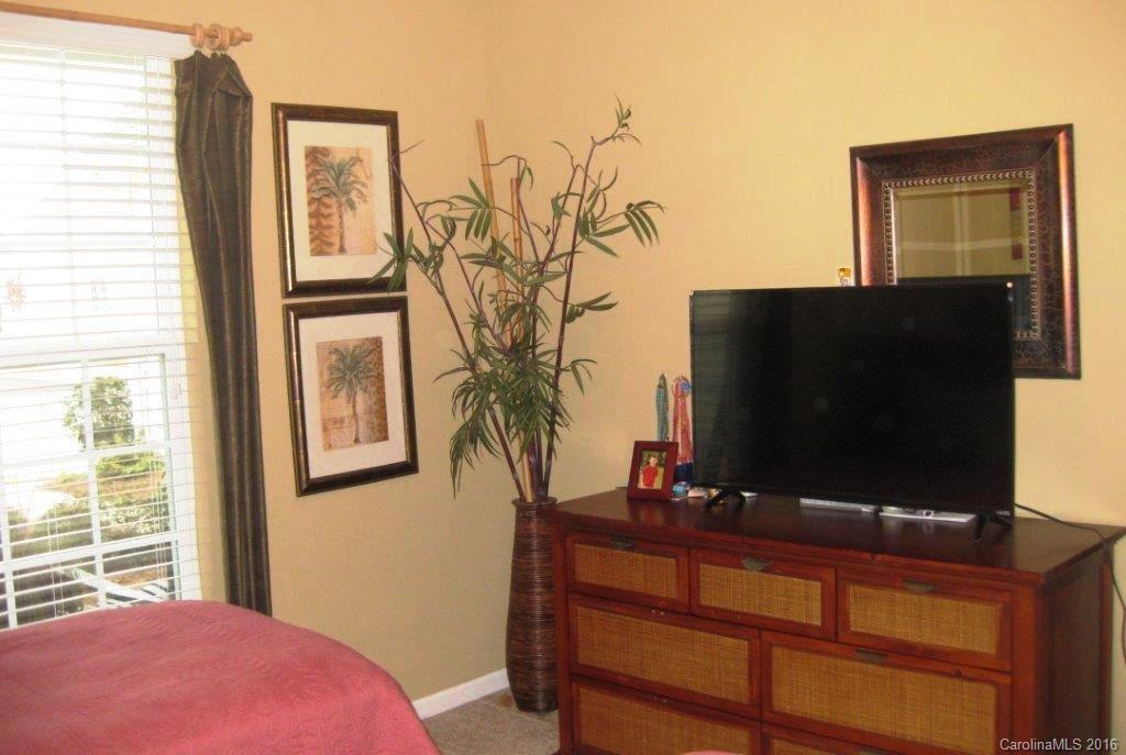 4093 Perth Road, Unit 380 Fort Mill, SC 29707 - Photo 14 of 24 a bedroom with a bed and flat screen tv