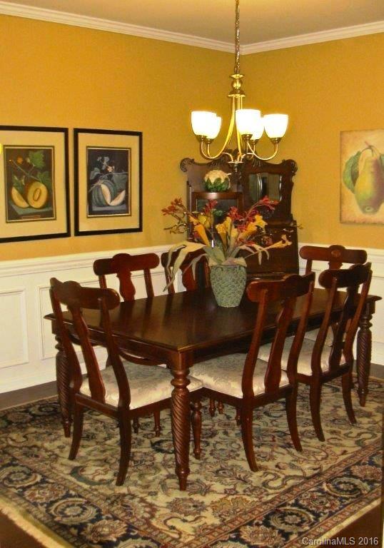 4093 Perth Road, Unit 380 Fort Mill, SC 29707 - Photo 5 of 24 a view of a dining room with furniture and chandelier