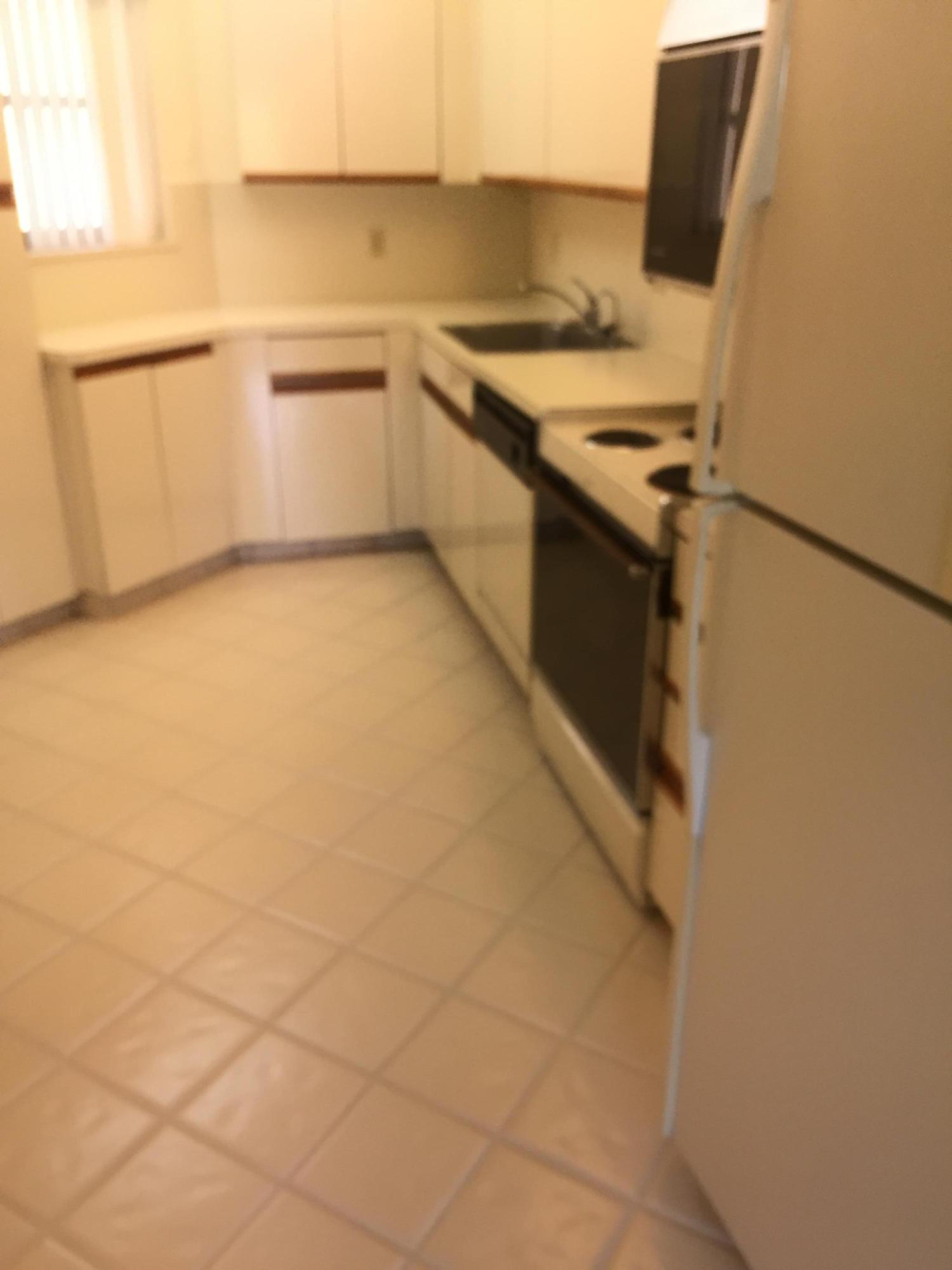 5750 Camino Del Sol, Unit 303 Boca Raton, FL 33433 - Photo 3 of 13 kitchen 2