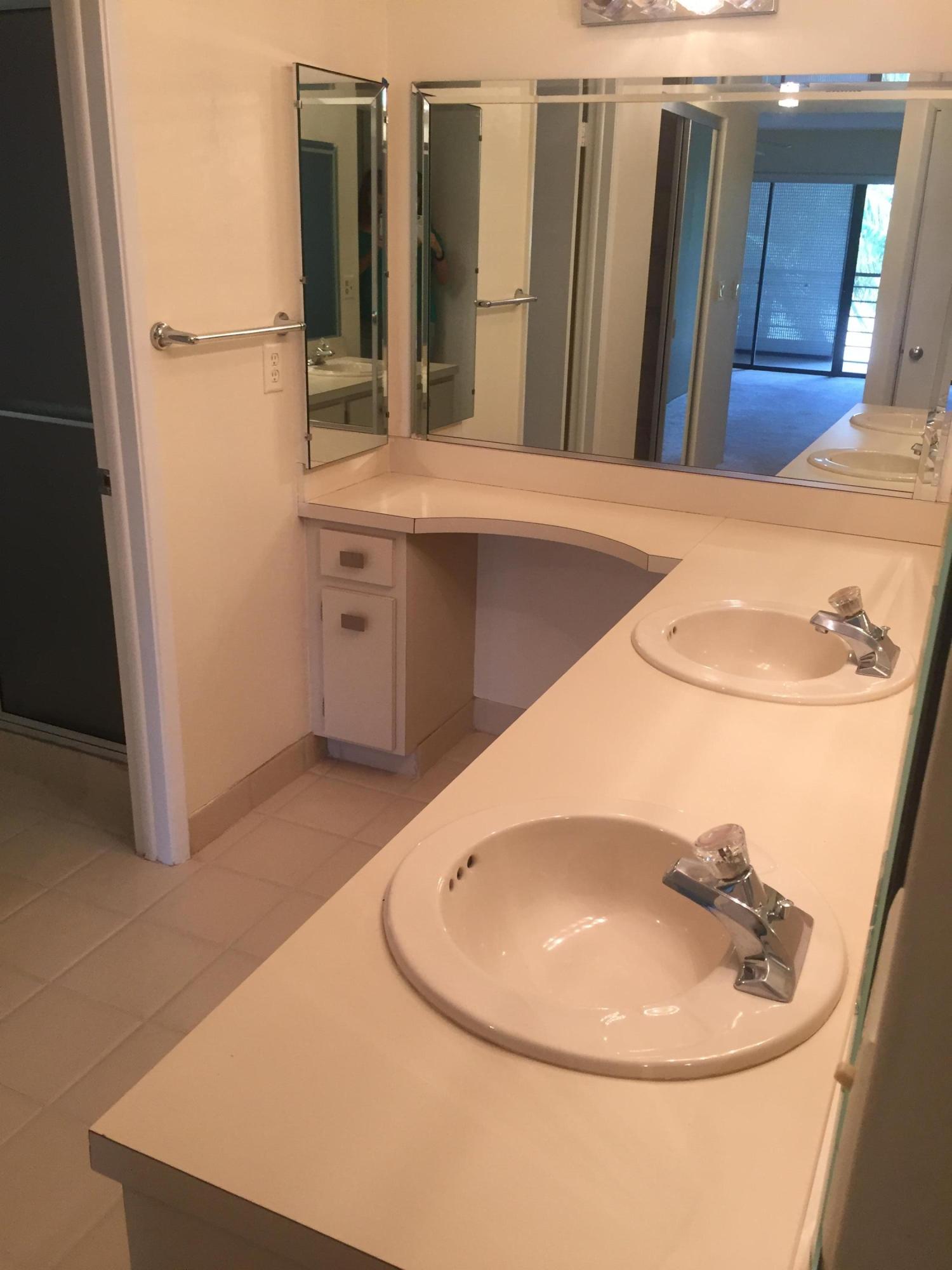 5750 Camino Del Sol, Unit 303 Boca Raton, FL 33433 - Photo 9 of 13 master bath 2