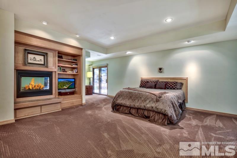 369 Summit Drive Stateline, NV 89449 - Photo 12 of 39 a bedroom with a large bed and a tv