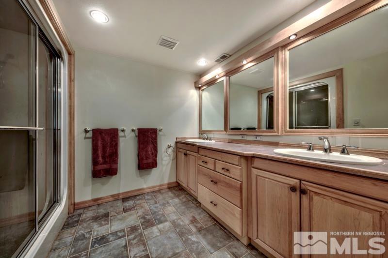 369 Summit Drive Stateline, NV 89449 - Photo 14 of 39 a spacious bathroom with a double vanity sink and a mirror