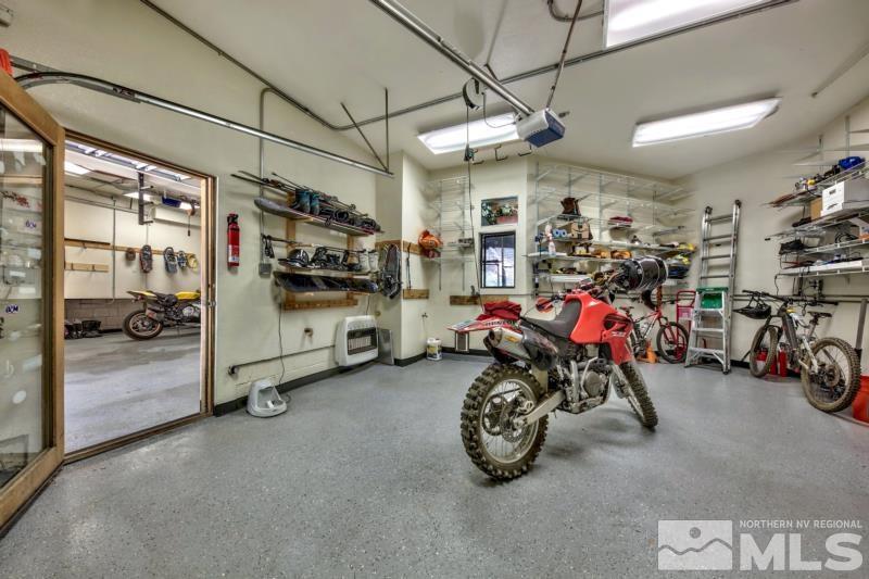 369 Summit Drive Stateline, NV 89449 - Photo 23 of 39 a view of a garage with a bike and a car