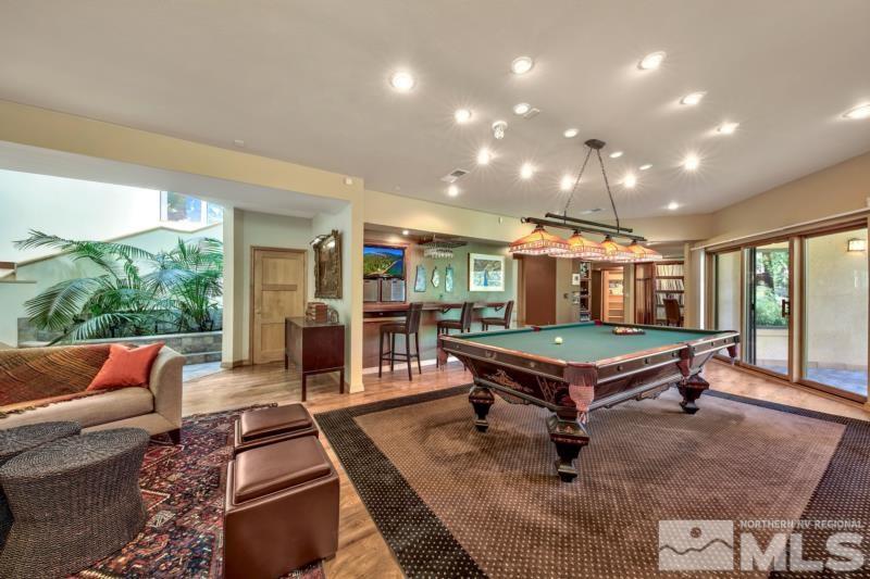 369 Summit Drive Stateline, NV 89449 - Photo 3 of 39 a room with furniture pool table wooden floor and windows