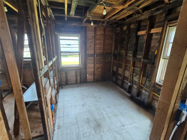 a view of an empty room with stairs