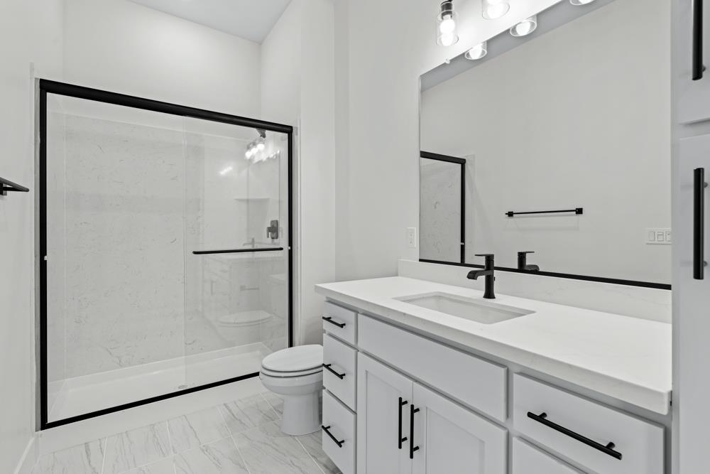 7058 Sheldon Rnch Drive Rancho Murieta, CA 95683 - Photo 18 of 26 a bathroom with a sink and a mirror