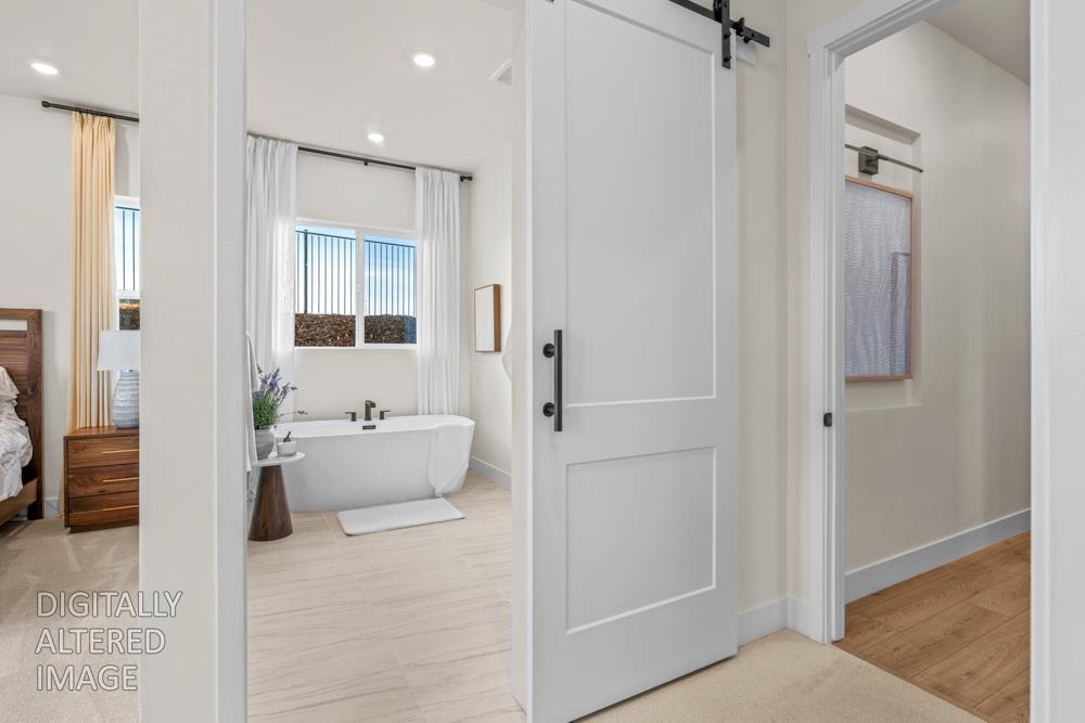 7058 Sheldon Rnch Drive Rancho Murieta, CA 95683 - Photo 23 of 26 a bathroom with a tub shower and bedroom view