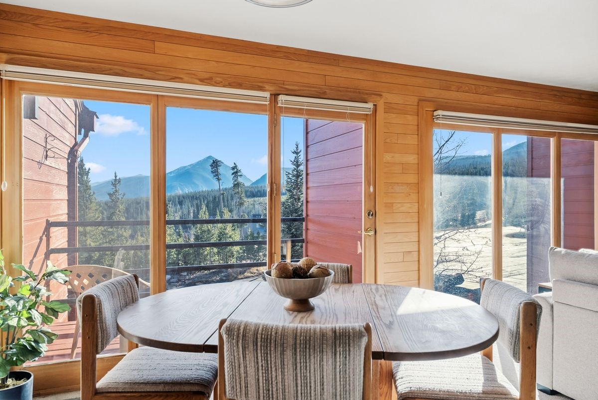 91300 Ryan Gulch Road, Unit 91311 Silverthorne, CO 80498 - Photo 6 of 29 a view of a dining room with furniture window and outside view