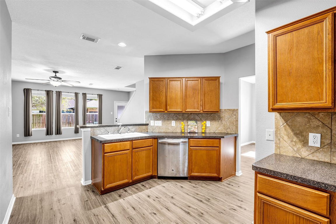 5026 Forest Hurst Drive Spring, TX 77373 - Photo 12 of 31 a kitchen with lots of counter top space and wooden floor