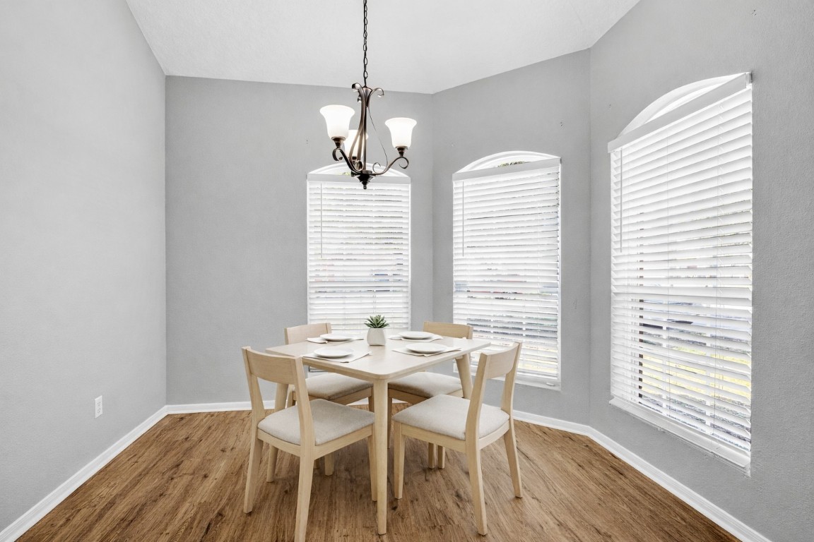 5026 Forest Hurst Drive Spring, TX 77373 - Photo 13 of 31 a view of a dining room with furniture window and wooden floor