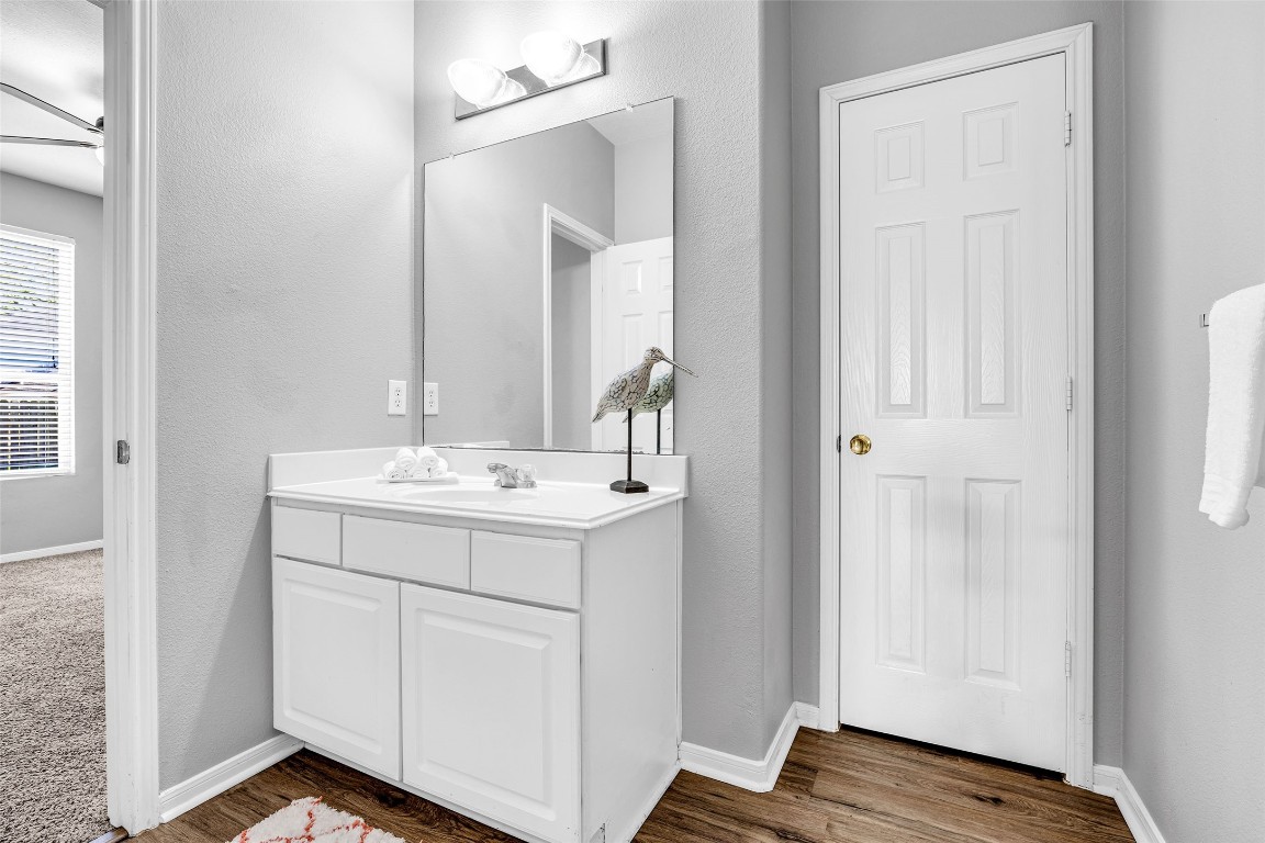 5026 Forest Hurst Drive Spring, TX 77373 - Photo 19 of 31 a bathroom with a sink and a mirror
