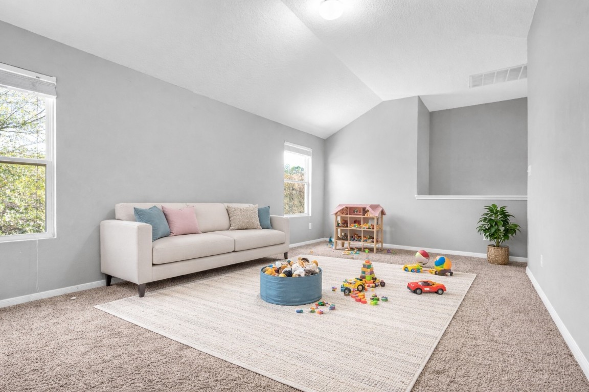 5026 Forest Hurst Drive Spring, TX 77373 - Photo 20 of 31 a living room with furniture and a potted plant