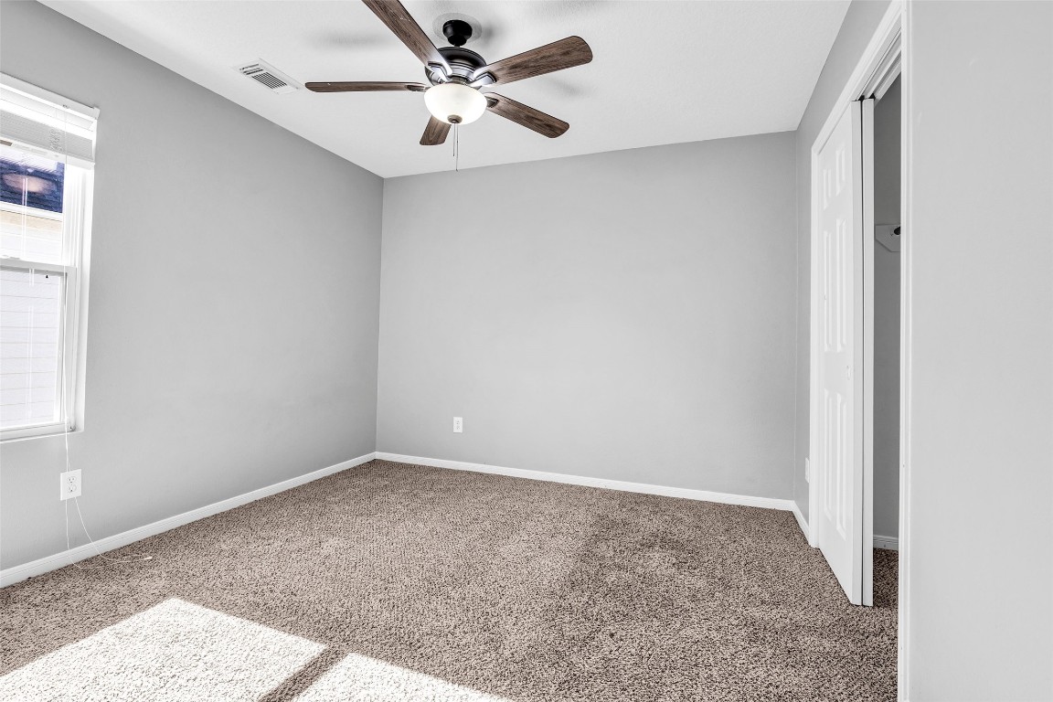 5026 Forest Hurst Drive Spring, TX 77373 - Photo 25 of 31 an empty room with a window and a fan