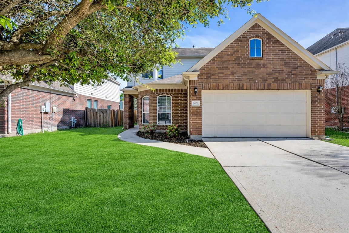 5026 Forest Hurst Drive Spring, TX 77373 - Photo 3 of 31 a front view of house with yard and green space