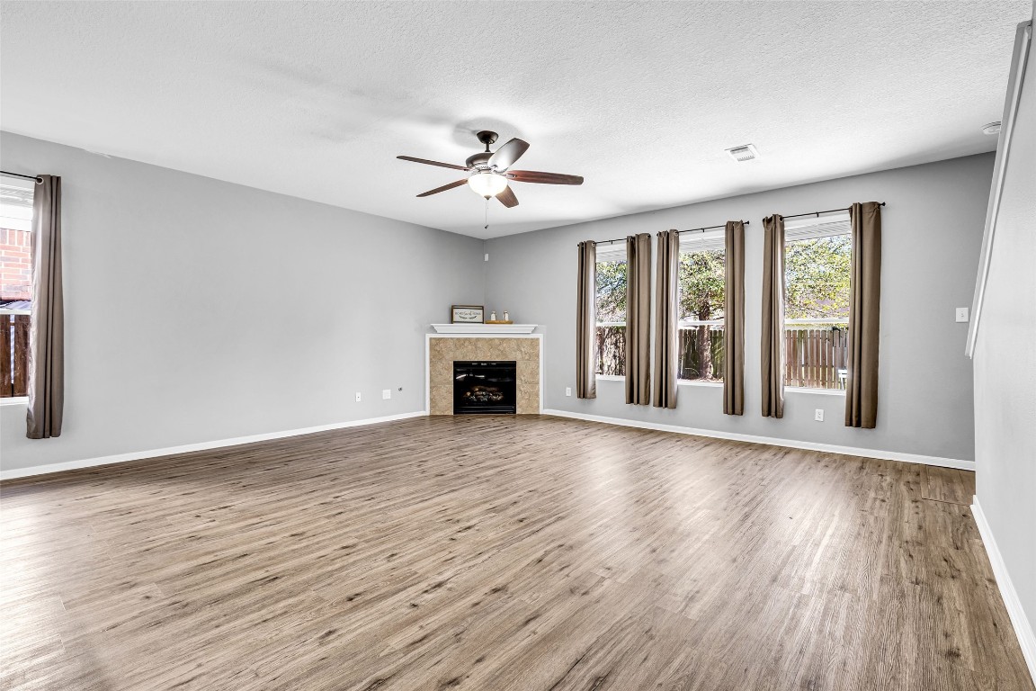 5026 Forest Hurst Drive Spring, TX 77373 - Photo 6 of 31 a view of an empty room with wooden floor and a window