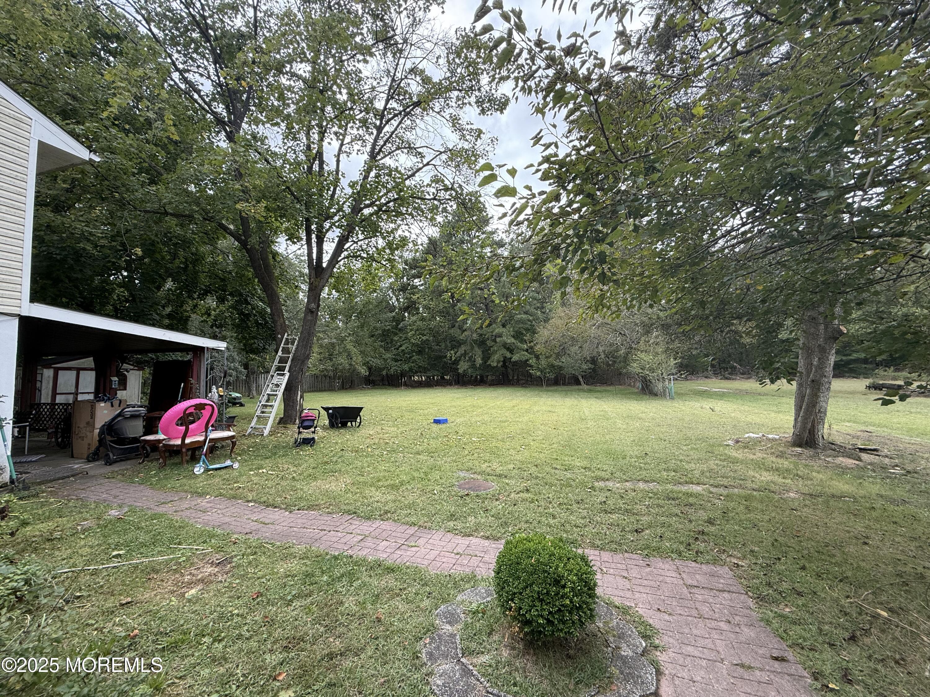 7 Charles Street Howell, NJ 07731 - Photo 3 of 8 a view of a park with large trees