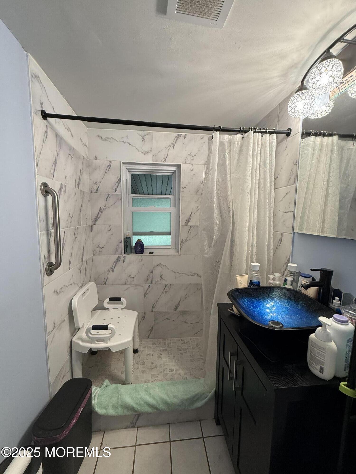 7 Charles Street Howell, NJ 07731 - Photo 8 of 8 a bathroom with a sink toilet and shower