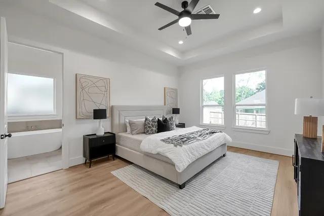 a bedroom with a large bed and a couch