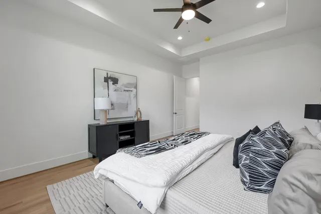 a bedroom with a bed and a table