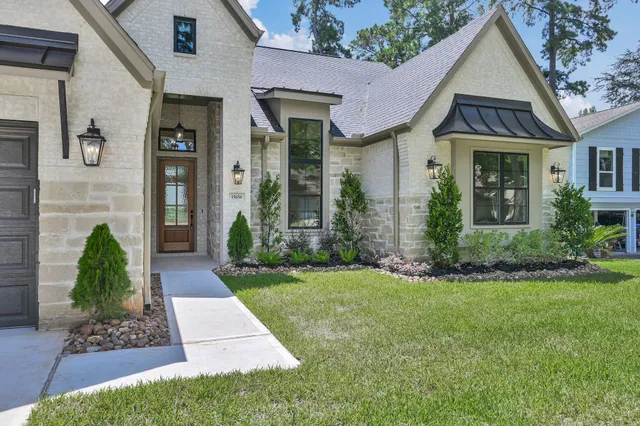 a front view of a house with garden