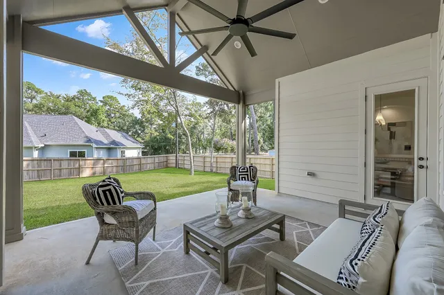 a view of a patio with a yard