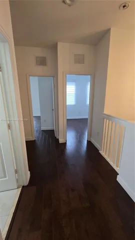 view of empty room with wooden floor