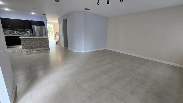 a view of a livingroom with a dishwasher and fireplace