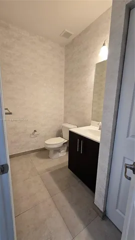 a view of a kitchen with a sink