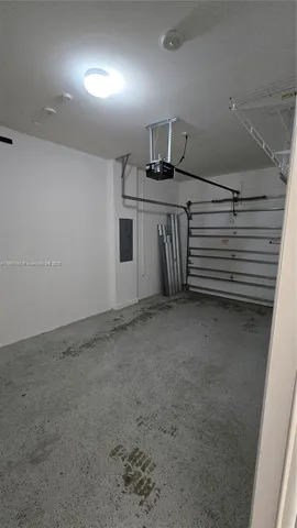 an empty room with windows and entrance