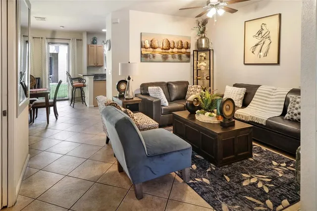 a living room with furniture and a rug